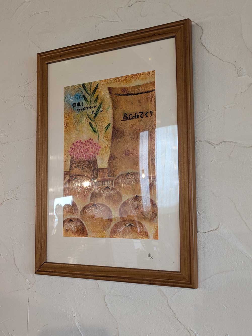 Cafeてくりの壁にかかている絵画